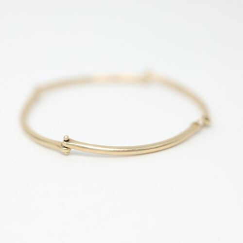 Hilary Finck rivet and ring bangle bracelet in 14k yellow gold