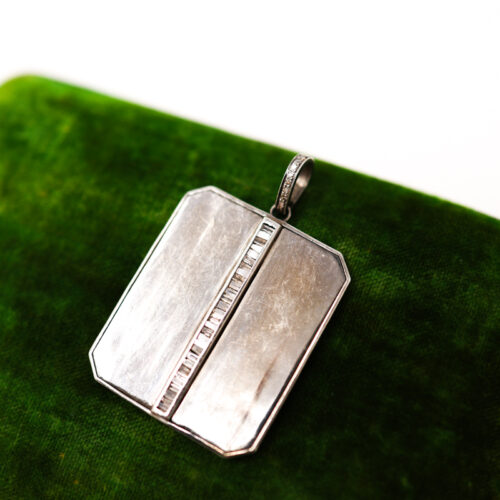 The woods silver and baguette diamond shield pendant