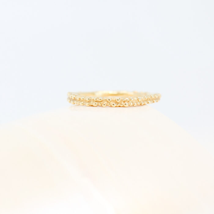textural yellow gold wedding band by Ruth Tomlinson - Image 2