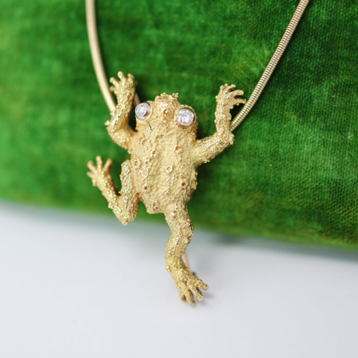 large textural solid gold frog with diamond eyes