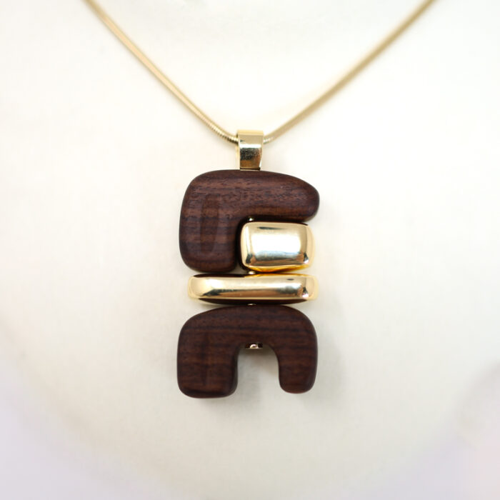 Joelle Kharrat jewelry wood and gold totem pendants