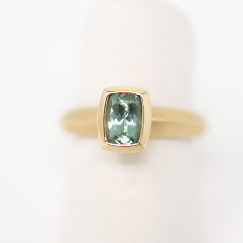Karin Jacobson cushion cut Malawi sapphire in Fairmined yellow gold