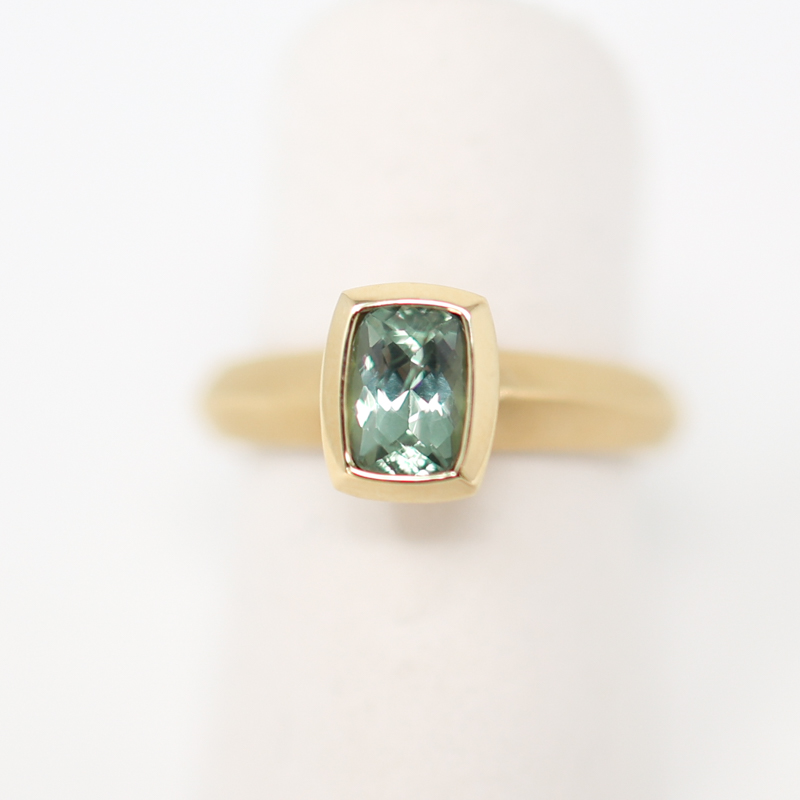 Karin Jacobson cushion cut Malawi sapphire in Fairmined yellow gold