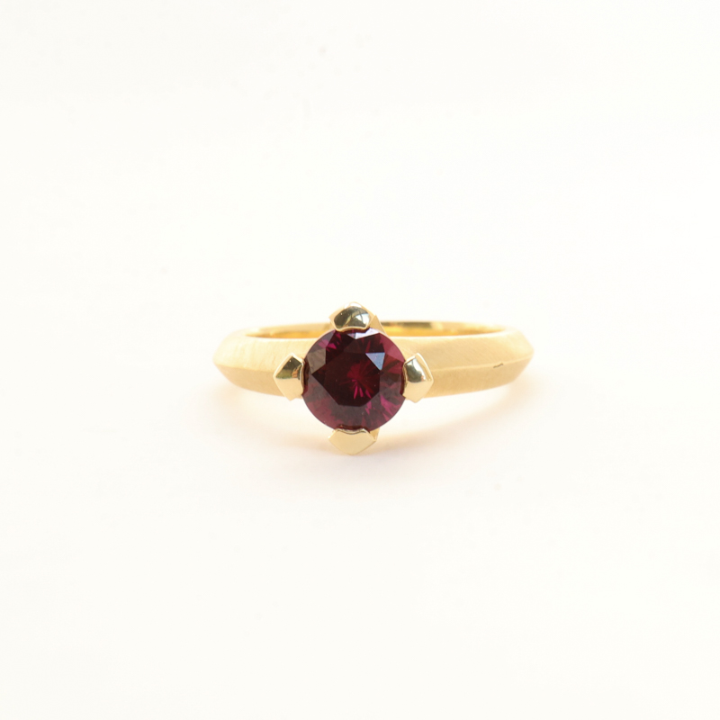 Karin Jacobson grape garnet prong set ring with knife edge if fairmined gold
