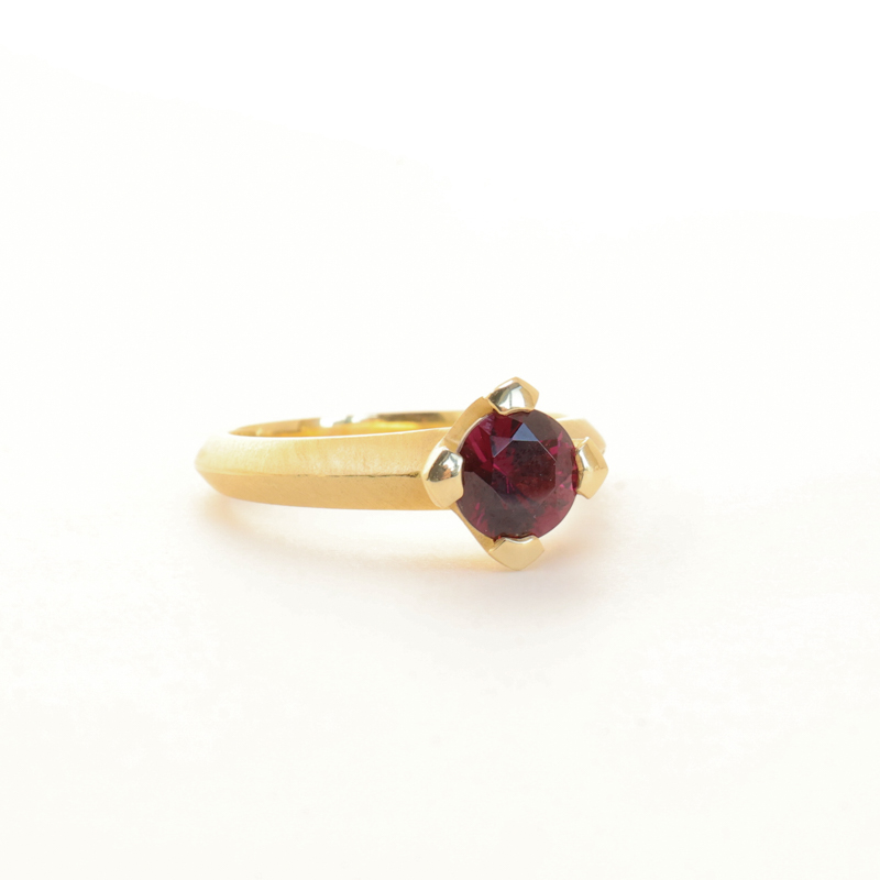 Karin Jacobson grape garnet prong set ring with knife edge if fairmined gold